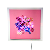 Shine Bright Neon Artwork, a pink neon sign over a painted rose canvas