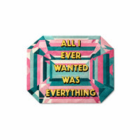 All I Ever Wanted Was Everything Pastel Gem Rug in candy pink, teal and sunshine yellow, an emerald cut gem shaped rug with the words tufted across it, lay-flat view