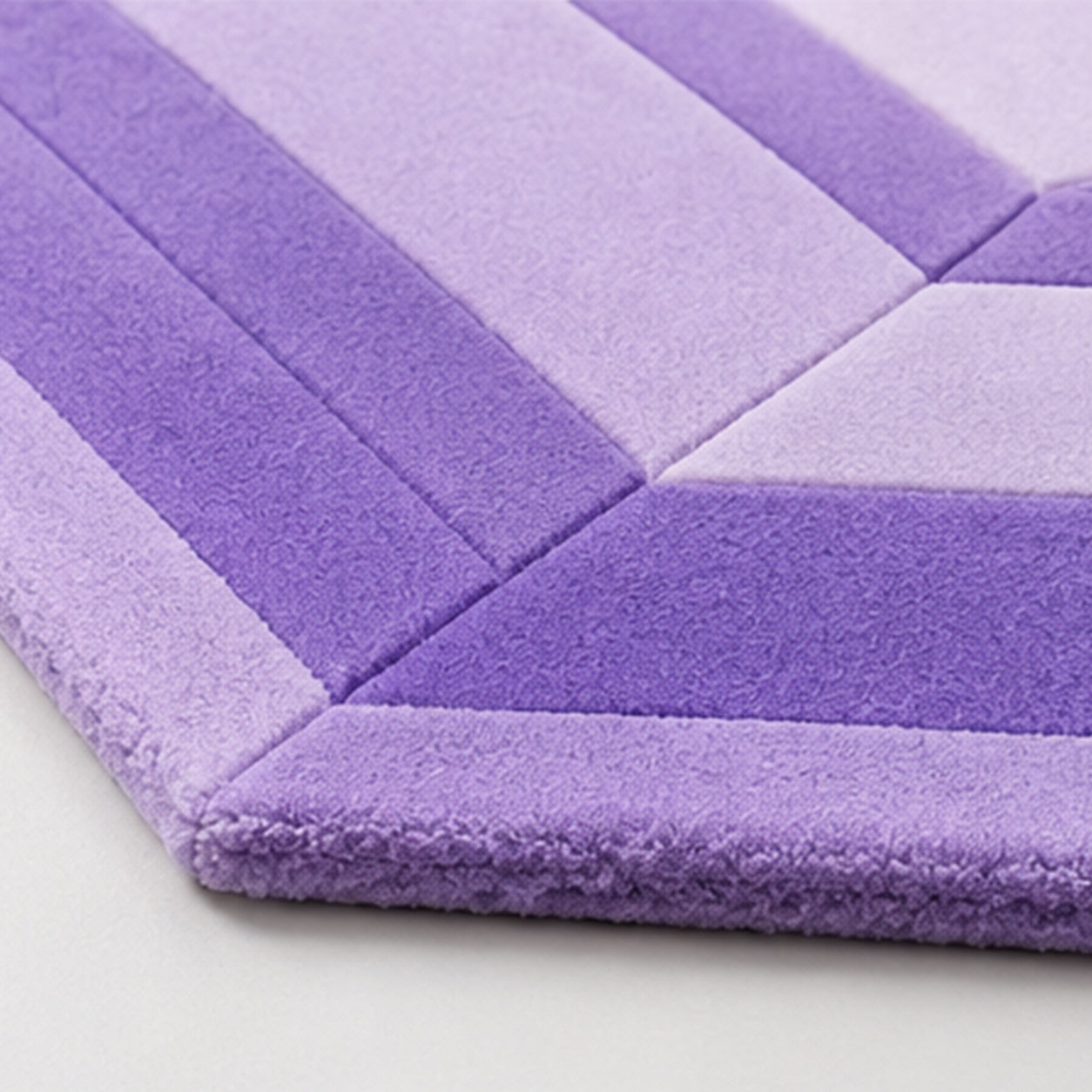 Detail of the hand-carved edge and one-inch wool pile on the Amethyst Lilac Emerald Gem Rug