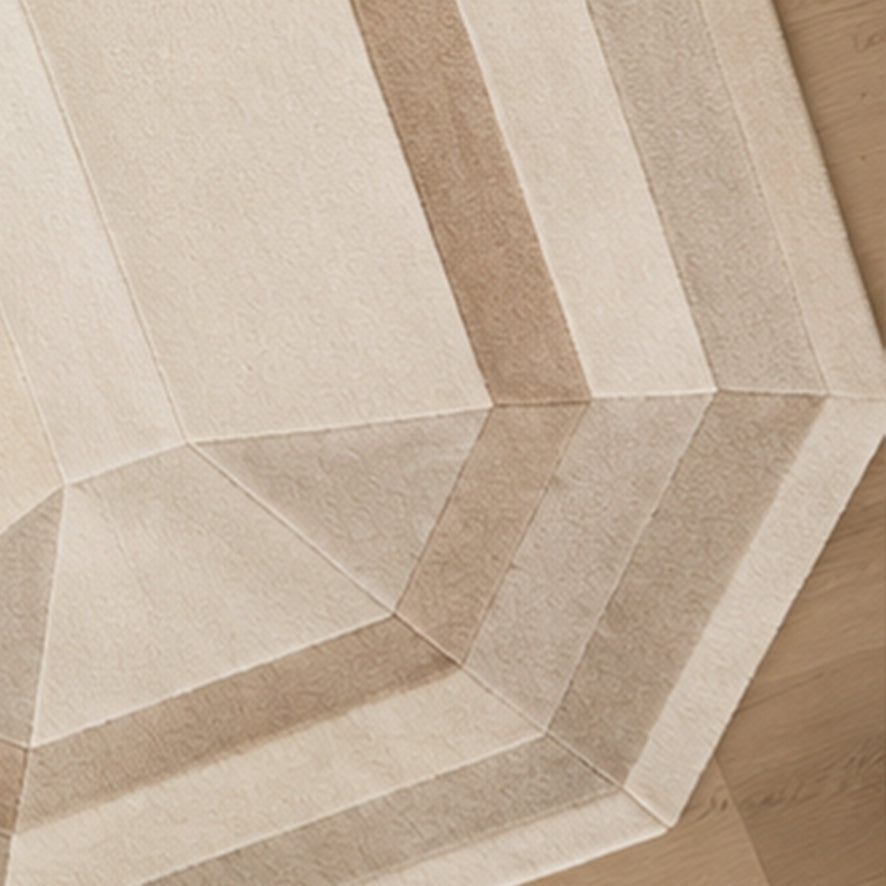 Close-up of the faceted neutral tones on the Beige Emerald Gem Rug
