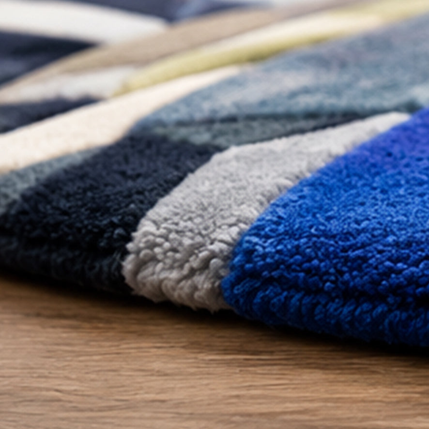 Detail of the blue and white faceted wool pile on the Blue Diamond Round Gem Rug