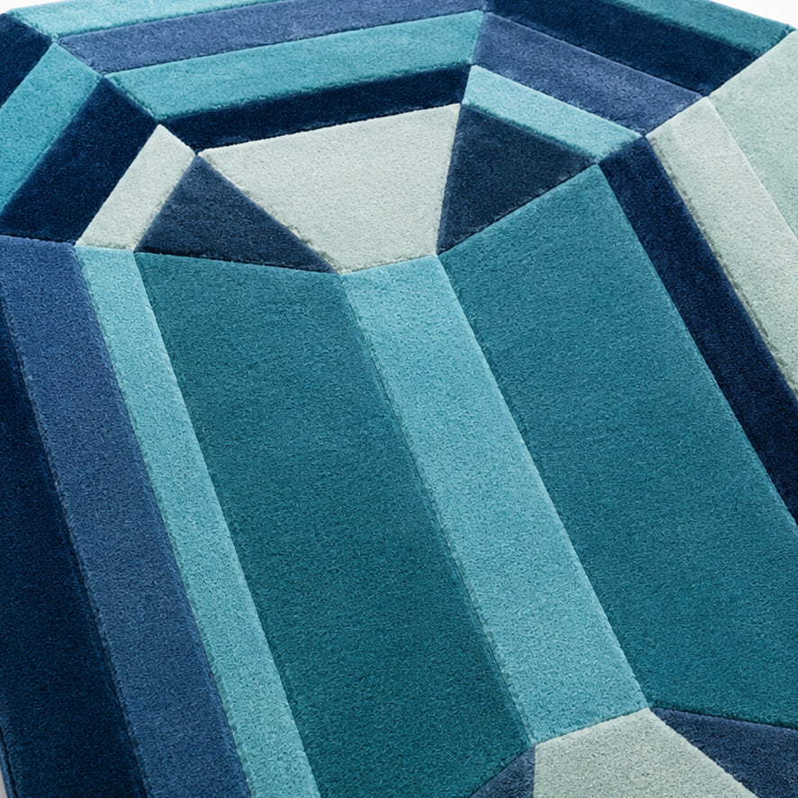 Detail of the teal, aqua and navy facets on the Blue Emerald Gem Rug