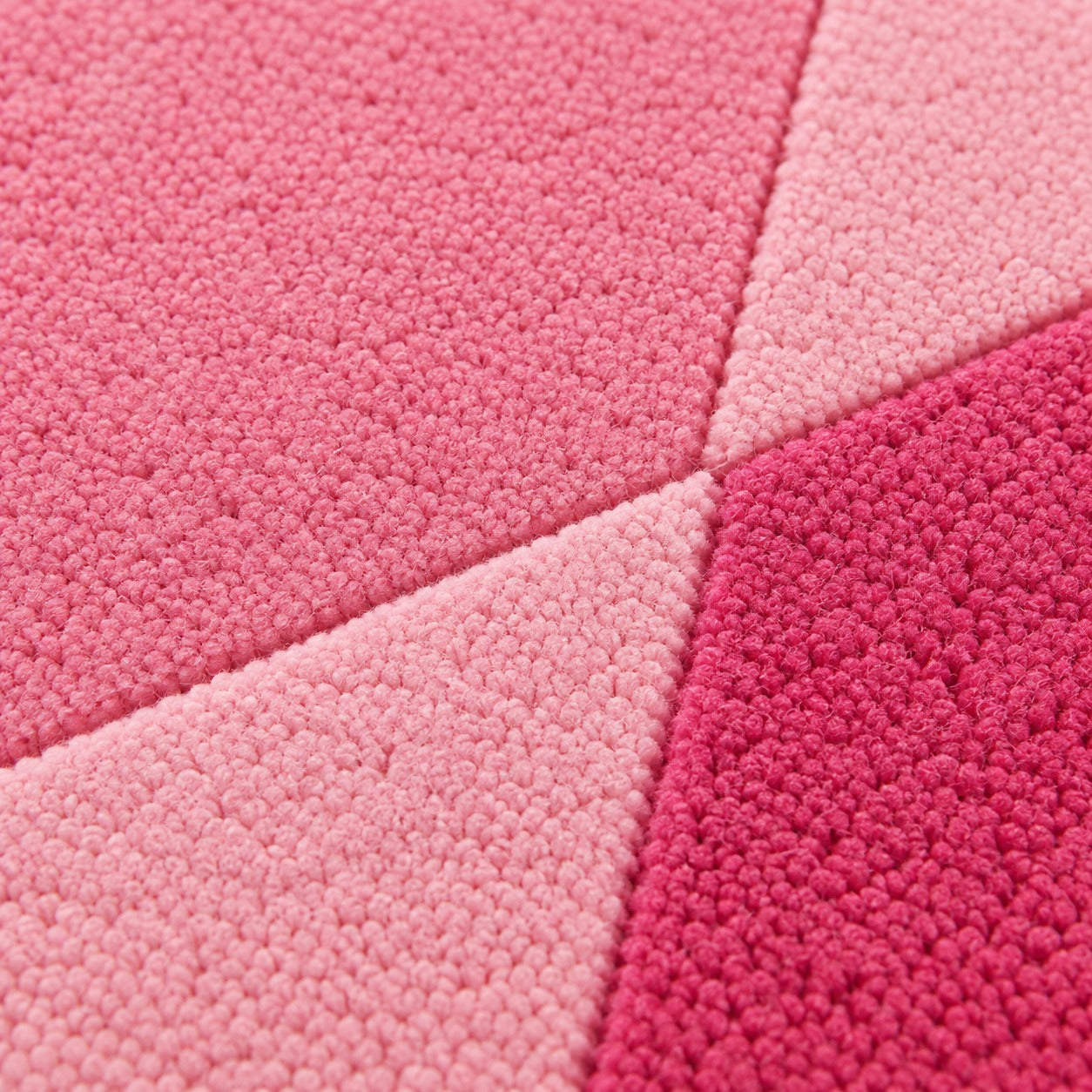 Close-up of the facets radiating from the pale center of the Rose Quartz Round Gem Rug